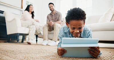 Buy stock photo Family, boy and tablet with smile on floor in living room of home for learning or online gaming. App, development and parents with child in house together for education, relax or streaming service
