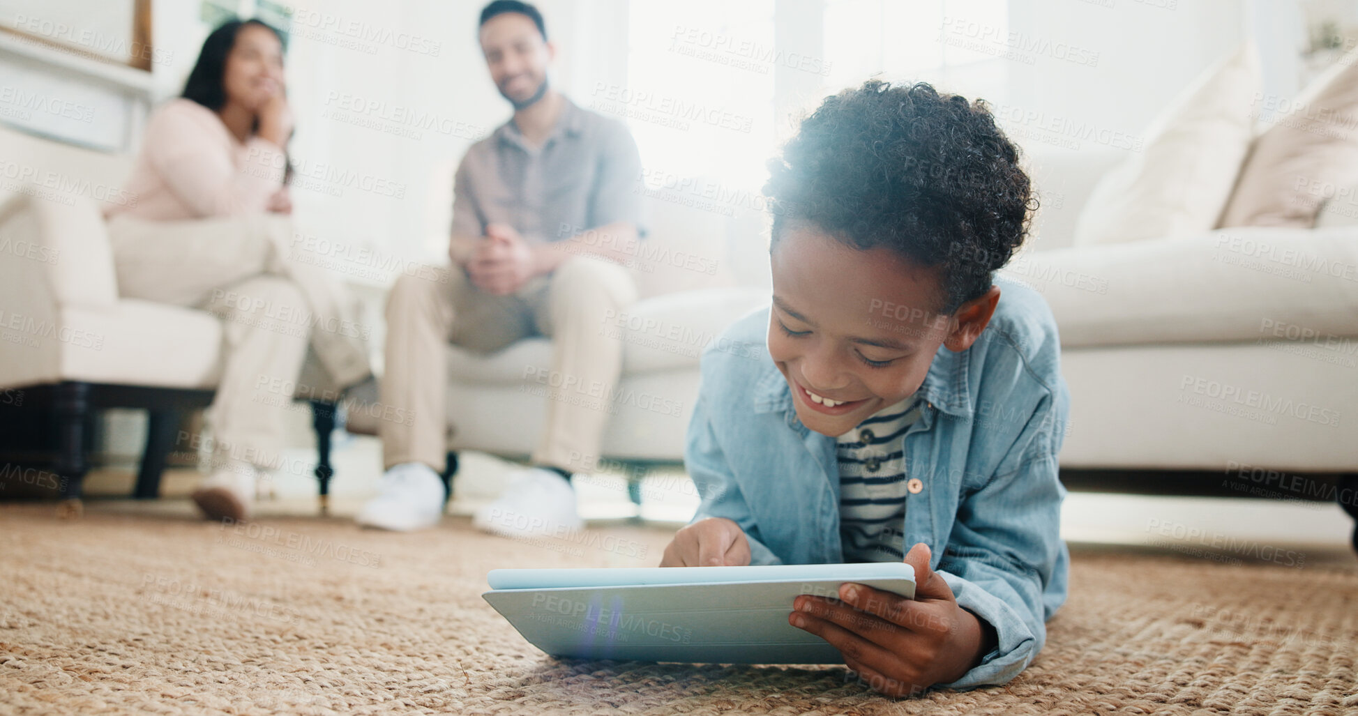 Buy stock photo Family, child and tablet with smile on floor in living room of home for learning or online gaming. App, development and parents with boy in house together for education, relax or streaming service