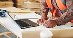 Writing, man and hands of carpenter with laptop in workshop for research on industrial project. Technology, notes and woodworker with computer for feedback on furniture manufacturing in factory.