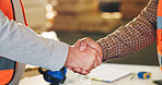 Construction, deal or people on site with handshake, building success or approval of project safety. Industrial, men or engineers with shaking hands, partnership agreement or clearance in compliance.