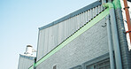 Building, factory or structure with air conditioner for cooling system or industrial architecture. Low angle, empty or space with brick wall, infrastructure or pipes for civil engineering on site