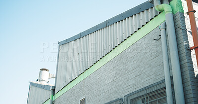 Buy stock photo Building, factory or structure with air conditioner for cooling system or industrial architecture. Low angle, empty or space with brick wall, infrastructure or pipes for civil engineering on site