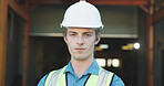 Architect, portrait and man with helmet on construction site, property development or design project. Serious, civil engineer and person with hard hat for safety, confident and renovation in USA