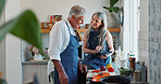 Cooking, tablet and elderly couple in kitchen with recipe, food blog and connection with meal prep. Smile, help and senior people in home with tech, online instructions and bonding in culinary hobby.