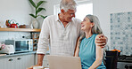 Mature, couple and hug in house with laptop, budget goals or complete payment of financial liability. Happy, married people and embrace with computer, debt settlement and wealth management success.
