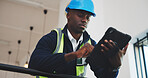Engineer, man and scroll in office with tablet, design building or research for property development. Low angle, black person and typing in workplace with tech, internet and planning for engineering.
