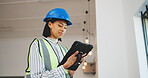 Woman, architect and research with tablet in building for renovation design or construction. Female person, civil engineer or contractor with technology for architecture development or improvement