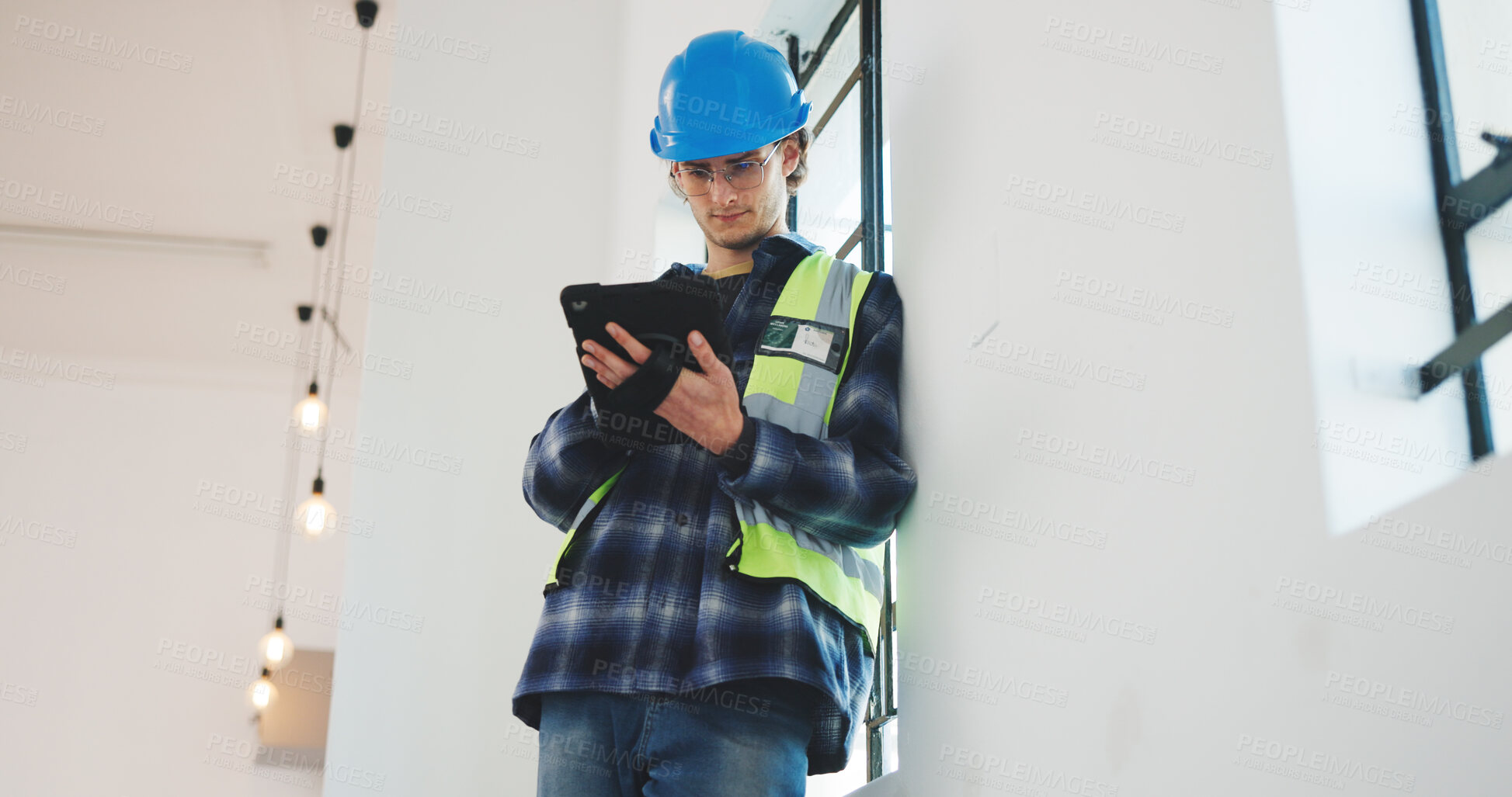 Buy stock photo Man, architect or construction with tablet for renovation, safety or security in building. Male person, civil engineer or contractor with technology for architecture project or development on site