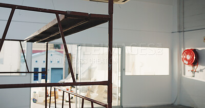 Buy stock photo Construction, empty or remodeling with interior, building site or development in structure repair. Industrial, vacant and refurbishment with scaffolding, maintenance and renovation of infrastructure.