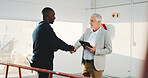 Handshake, real estate and tablet with businessmen in corporate space for purchase or rental deal. App, introduction and workplace tour with people shaking hands for agreement or property showing