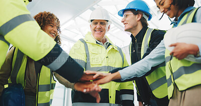 Buy stock photo Happy, architect and team with hands together in meeting for construction, mission or collaboration. People, civil engineer or group of contractors piling with smile or stack for unity in building