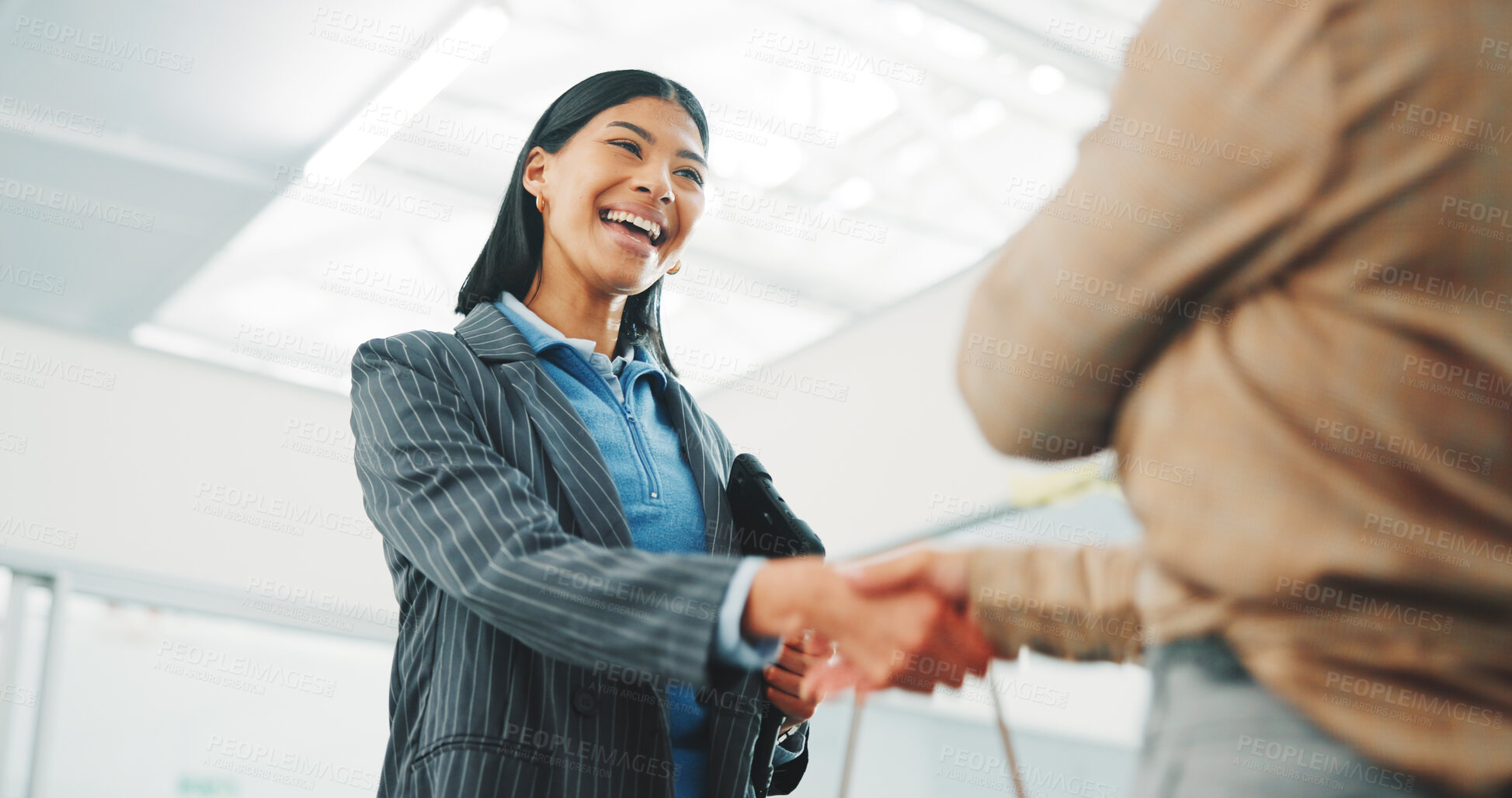 Buy stock photo Handshake, deal and business women in office with meeting, sale or closing on property listing. Welcome, happy and real estate agent shaking hands with client for lease agreement at agency from below
