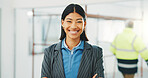 Portrait, architect and woman at construction site with arms crossed, project and design experience. Happy, person or property designer with confidence, renovation or pride for architecture expertise