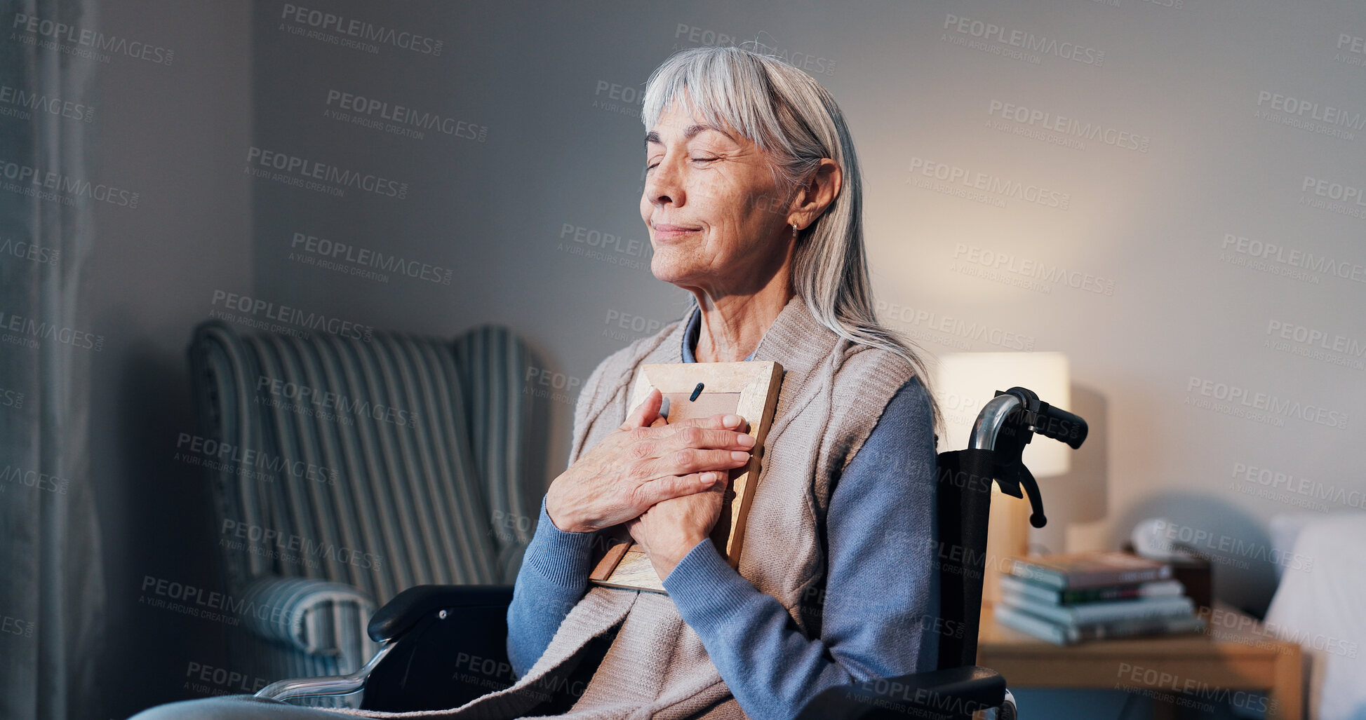Buy stock photo Senior, hug or happy woman with picture frame in wheelchair for good memory, past moment or comfort. Elderly, widow or female person with a disability or photo for peace or relief in retirement home