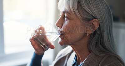 Buy stock photo Drinking water, retirement and senior woman in home for benefits of hydration or refreshment. Beverage, glass and thirsty with old person in bedroom of apartment for assisted living or wellness