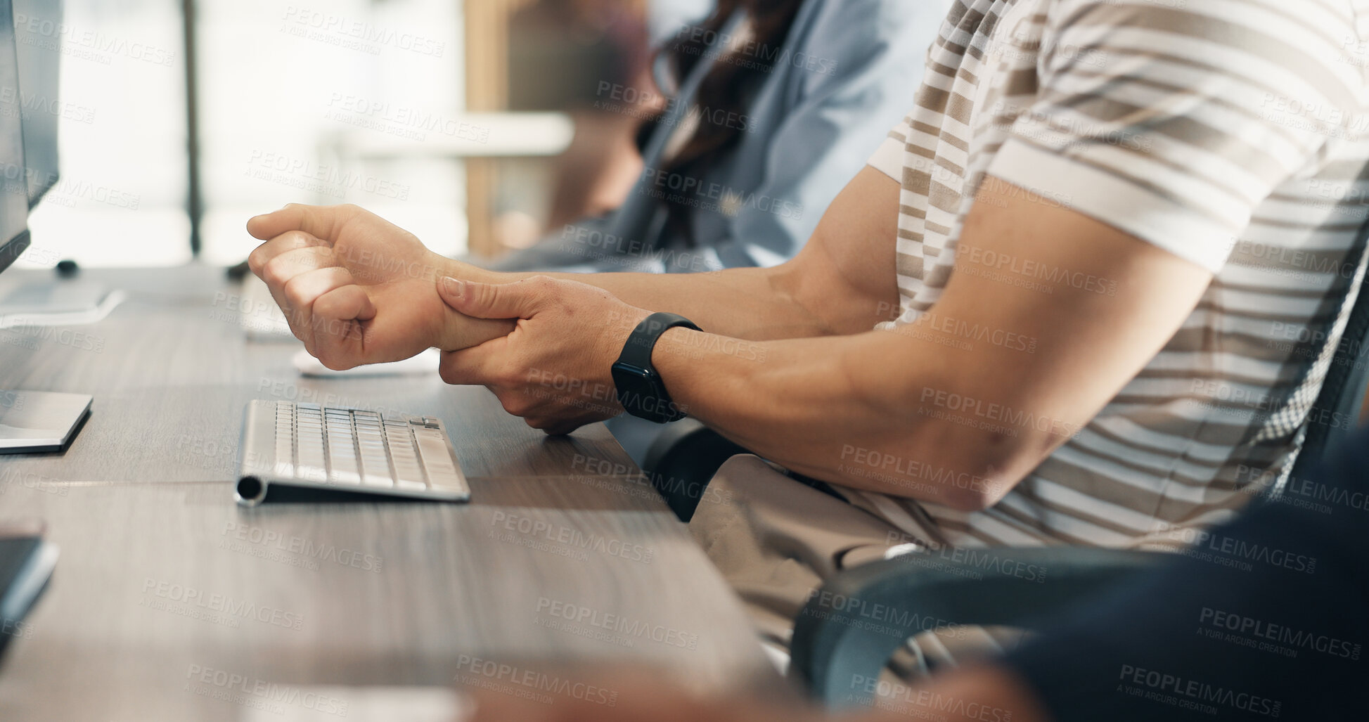 Buy stock photo Business people, computer and hands with wrist pain in office from injury, strain or article deadline. Media agency, coworking and journalist with joint ache from carpal tunnel, editing or discomfort