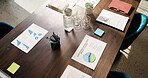 Above, table or paperwork in empty office with data, sales revenue charts or business stats proposal. Meeting, boardroom and documents in workplace with income forecast, graphs and plan for company.
