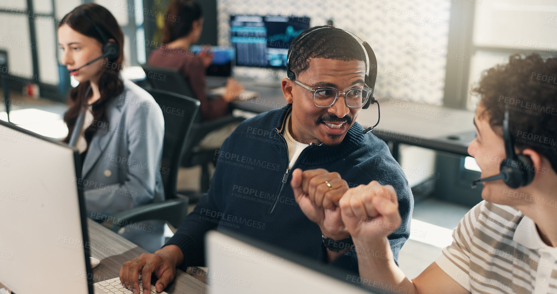 Buy stock photo Call center, mic or men in office with fist bump, deal closed or motivation for lead generation. Coworking, headset or agent with tech, telemarketing success or encouragement for commission milestone