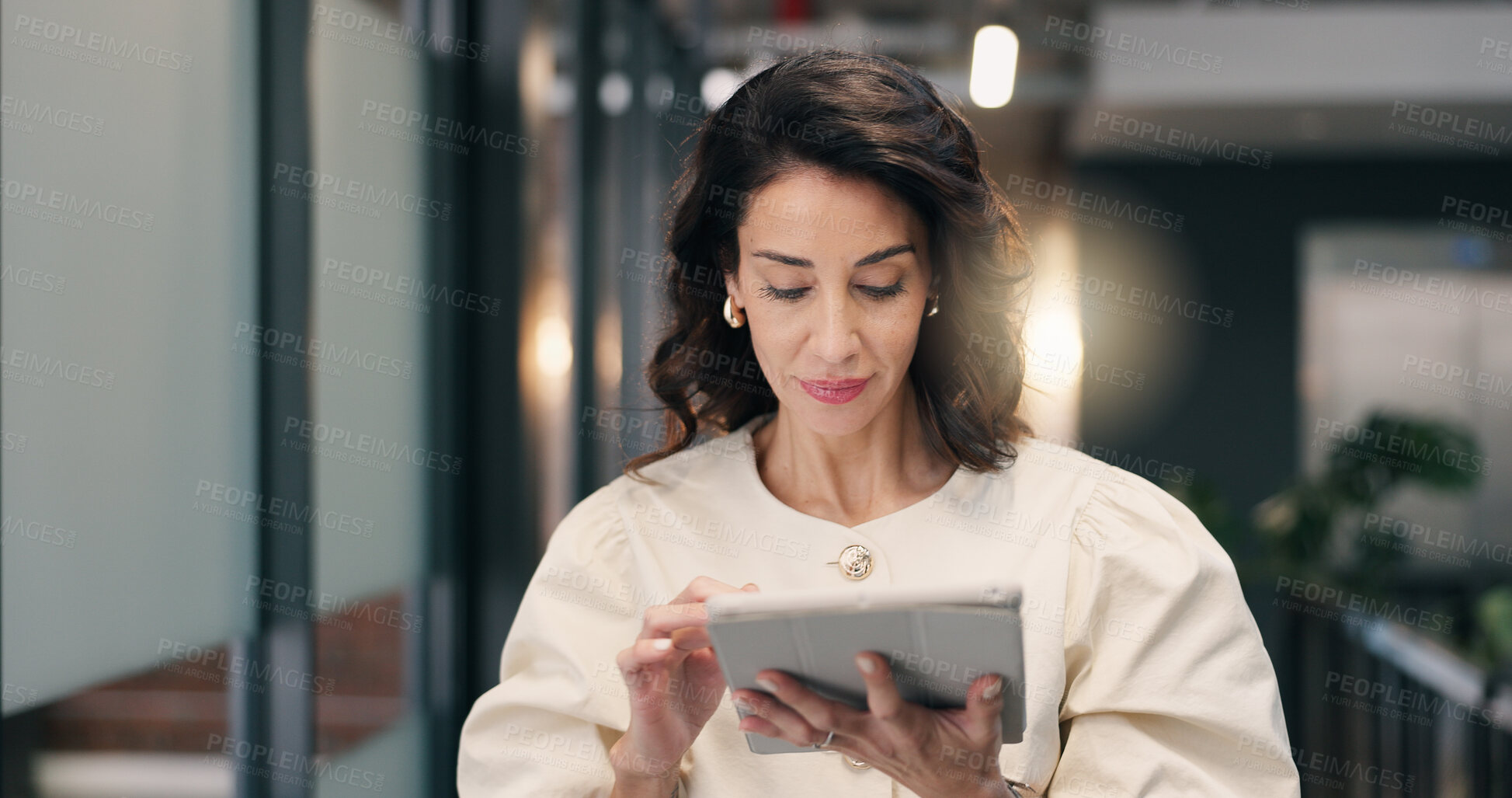 Buy stock photo Businesswoman, walk and scroll in office with tablet, review press release and social media comment. Mature person, public relations manager and reading with tech, check PR statement and online news.