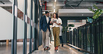 Business, people and walk in office with tablet, check press release or discussion for media project. Public relations manager, team and talk in hallway with tech, review PR statement or online news.