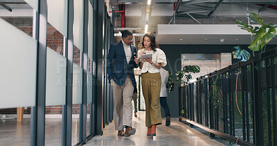 Buy stock photo Business, people and walk in office with tablet, check press release or discussion for media project. Public relations manager, team and talk in hallway with tech, review PR statement or online news.