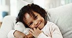 Portrait, child and hug with teddy bear in home for holiday, fun childhood or development on sofa. Girl, kid or toddler with smile, stuffed animal or embrace for comfort toy or weekend break in house