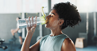 Buy stock photo Fitness, bottle and woman in gym with drinking water, refreshment and pause with activity recovery. Wellness, h2o and athlete with cold beverage, hydration support and exercise break in center.