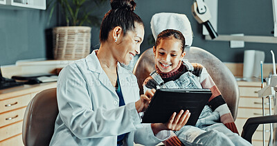 Buy stock photo Dentist, woman and tablet with child, advice and appointment for checkup or cleaning service. Orthodontist, happy girl or consulting with digital tech for dental care, oral hygiene or smile in clinic