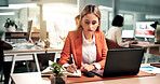 Woman laptop and writing in office with notebook, record data and sales analysis for company report. Coworking, person and analyst with computer, planner notes and graphs for business revenue stats.