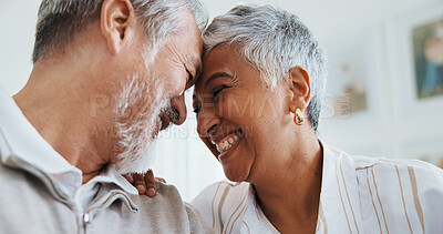 Buy stock photo Senior, couple and happy in home with love, funny conversation and connection in relationship. Laughing, people and affection in retirement with forehead touch, healthy marriage or bonding with chat