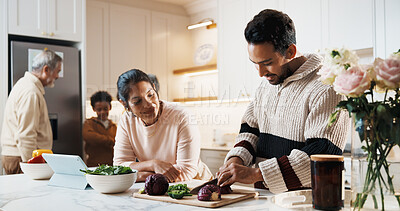 Buy stock photo Smile, couple and cooking in kitchen with tablet, meal prep and online recipe for healthy food. People, chopping and vegetables at house with tech, tutorial video and culinary skills for family lunch