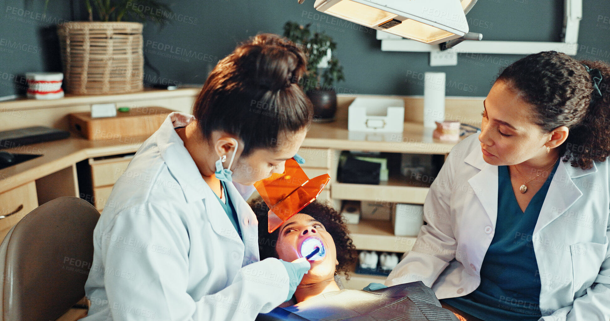 Buy stock photo Dental, exam or patient with dentist for cleaning, cavity or gum disease in consultation for health. Orthodontist, assistant and women for teeth whitening, oral care or treatment for mouth procedure