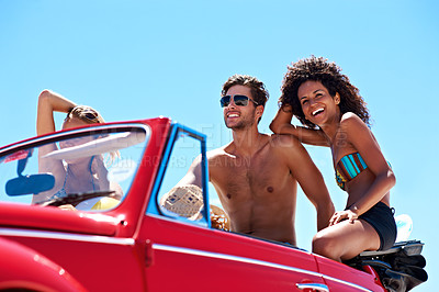 Buy stock photo Summer, people and road trip in car with vacation, outdoor together or happy for bonding on weekend. Friends, drive or relax in convertible vehicle with smile, journey or travel for holiday adventure