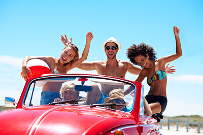 Buy stock photo Freedom, friends or road trip in car for holiday celebration, travel or excited for summer. Convertible, laugh or people on vacation with hands up, beach ball or portrait outdoor in vintage transport