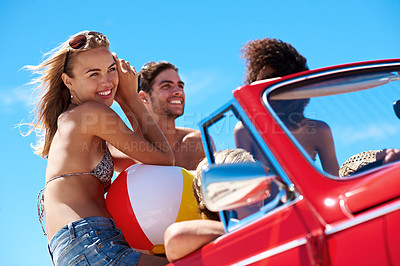Buy stock photo Summer, friends and road trip in car with vacation, outdoor together or happy for bonding on weekend. People, drive or relax in convertible vehicle with smile, journey or travel for holiday adventure