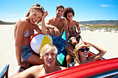 Buy stock photo Beach, friends and road trip in car for summer, drive or excited for holiday together. Convertible, laugh and people on journey with smile, ball or portrait outdoor in vintage transport for vacation