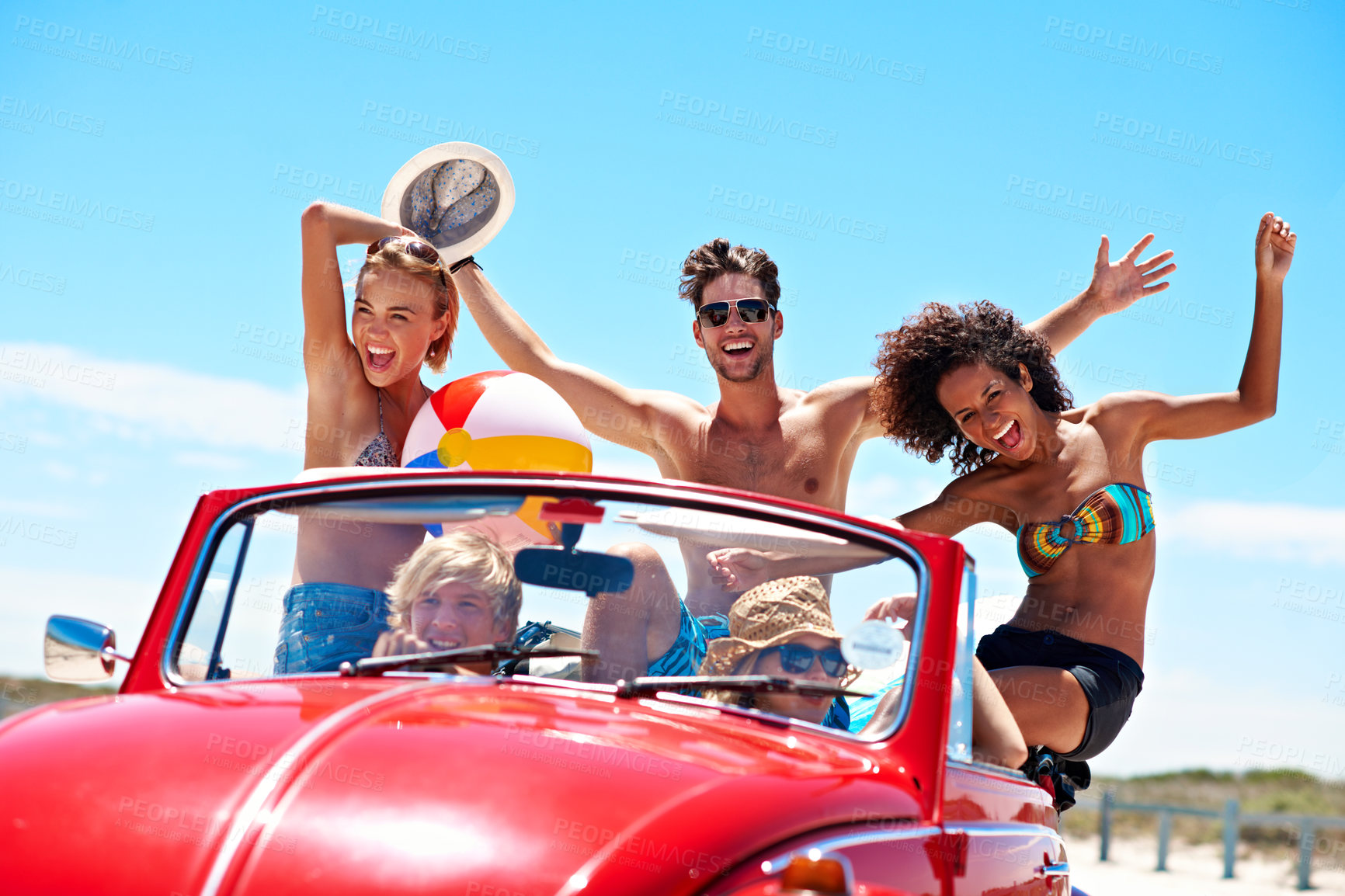 Buy stock photo Excited, friends and road trip in car for summer holiday, smile or travel outdoor for bonding together. Portrait, happy people and drive in convertible vehicle with freedom, journey and vacation.