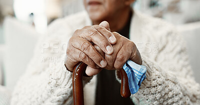 Buy stock photo Senior, man and hands with cane in retirement home for balance, support or nostalgia. Closeup, male person or thinking with walking stick for elderly care, aid or reminisce on sofa in old age house
