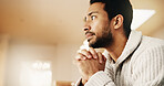 Man, thinking and waiting with doubt in home for mental health, trauma or fear for anticipation. Anxious, nervous or male person contemplating with hope or phobia for past moment or memory in house