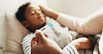 Hands, mom and kid in home with thermometer, childcare and health monitor with flu symptoms. Sick, mother or child in living room with tech, parent comfort or temperature check in illness assessment.