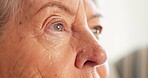 Thinking, eyes and senior woman in house with insight, daydreaming and nostalgia in calm mindset. Retirement, space and elderly person with memory, flashback and peaceful perspective in home.