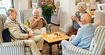 Break, friends and talking with old people in living room of retirement home for community support. Conversation, happy and relax with group of seniors in apartment together for bonding or wellness