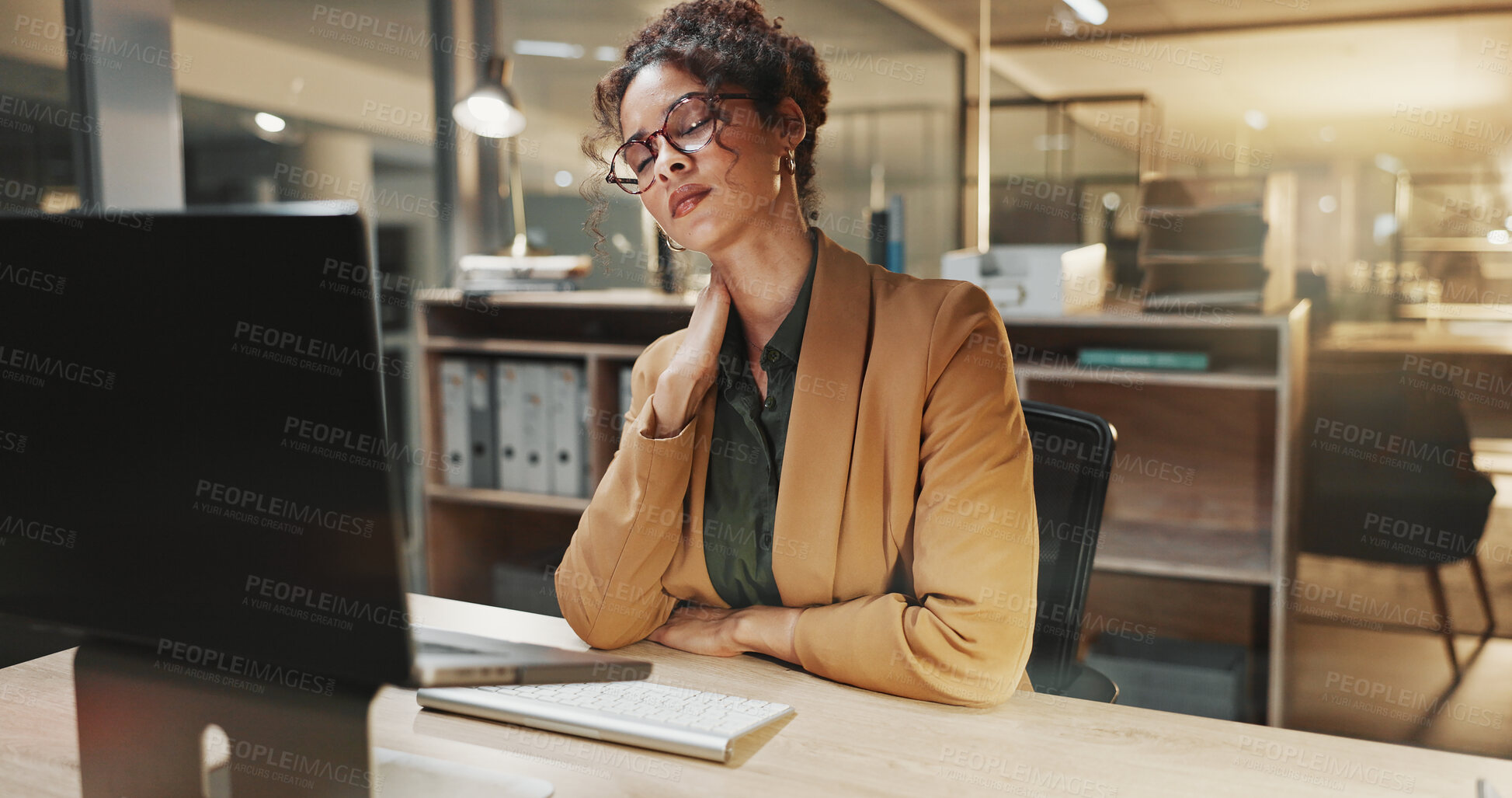 Buy stock photo Technology, neck pain and businesswoman in office at night with bad ergonomics at finance career. Computer, spinal injury and financial manager with deadline for investment project in workplace.