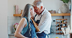Happy, cooking and love with old couple in kitchen for bonding, forehead touch and meal prep. Connection, support and food with senior man and woman in home for retirement, trust and recipe together