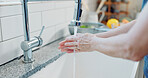 Water, woman and washing hands in kitchen for hygiene, dirt removal and germ prevention at sink. Healthy habit, person and cleaning bacteria at home faucet for wellness, self care and cleanliness