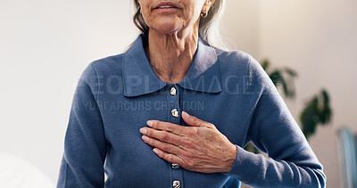 Buy stock photo Senior, woman and hands in retirement home with chest pain, heartburn symptoms and medical problem. Uncomfortable, elderly person and acid reflux in house with indigestion, illness and health issue.