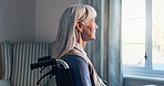 Thinking, wheelchair and window with senior woman in retirement home for memories or nostalgia. Flare, remember and old person with disability in living room for contemplation, ideas or morning view