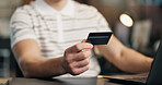 Man, hands and credit card with laptop in office for online shopping, purchase or payment. Businessman, employee or shopper with debit or computer for ecommerce, wireless transaction or banking app
