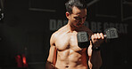 Fitness, gym and bodybuilder man with dumbbells or weights for training, muscle growth and self care. Iron, workout and person with health club membership for exercise, strong arms and wellness