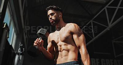 Buy stock photo Dumbbells, gym and bodybuilder man with music and serious for training, muscle growth and self care. Earphones, workout playlist and person or low angle of exercise for fitness, strong and power